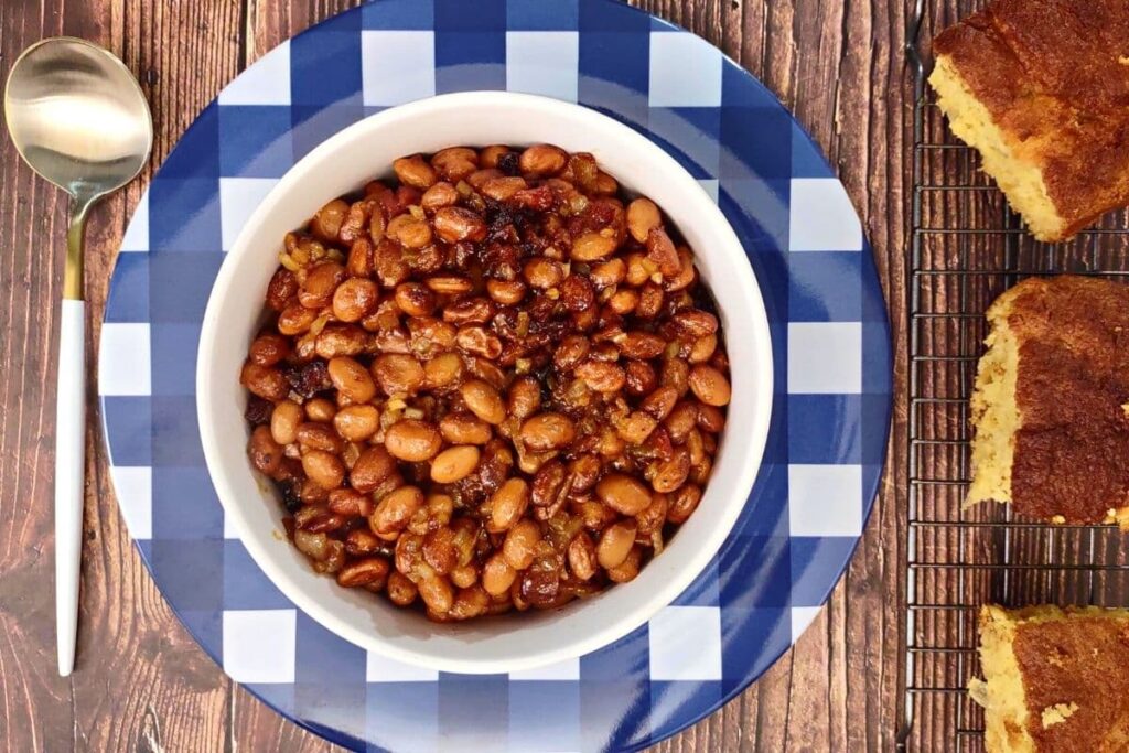 overhead view of air fryer bbq baked beans with bacon