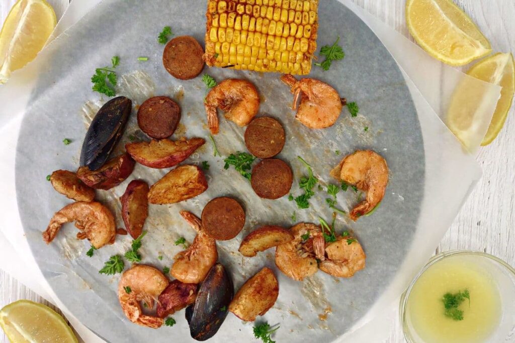 overhead view of reheated seafood boil on a plate