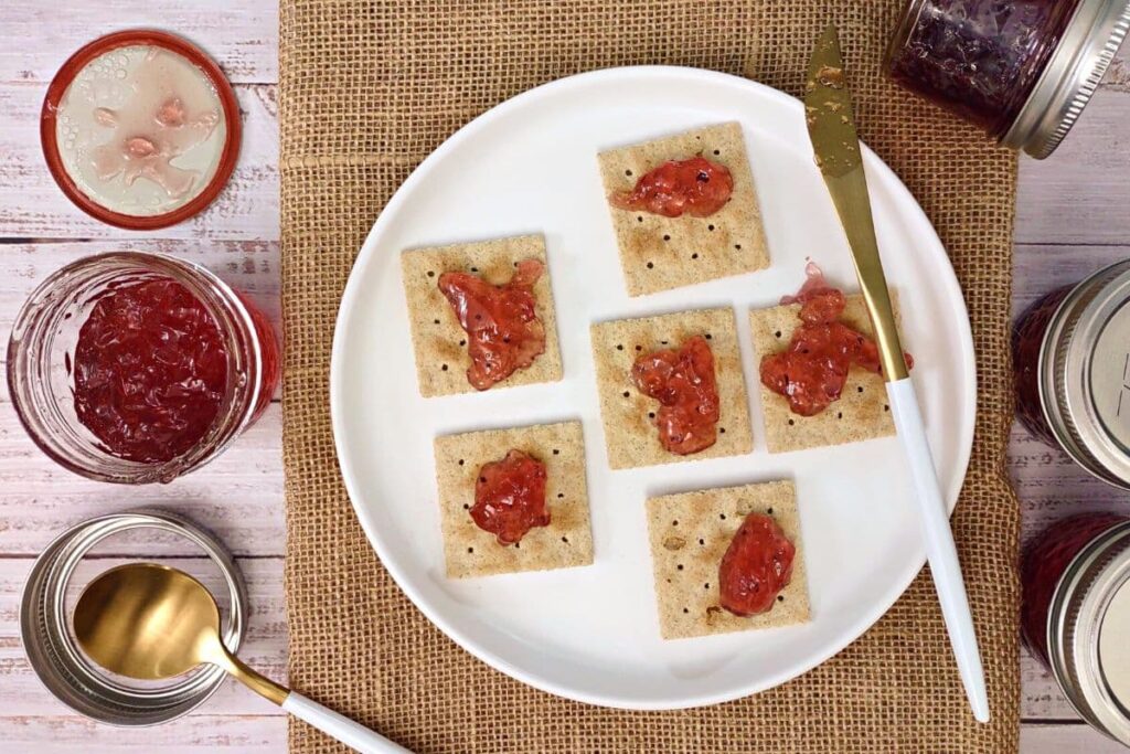 overhead view of sangria wine jelly spread over crackers