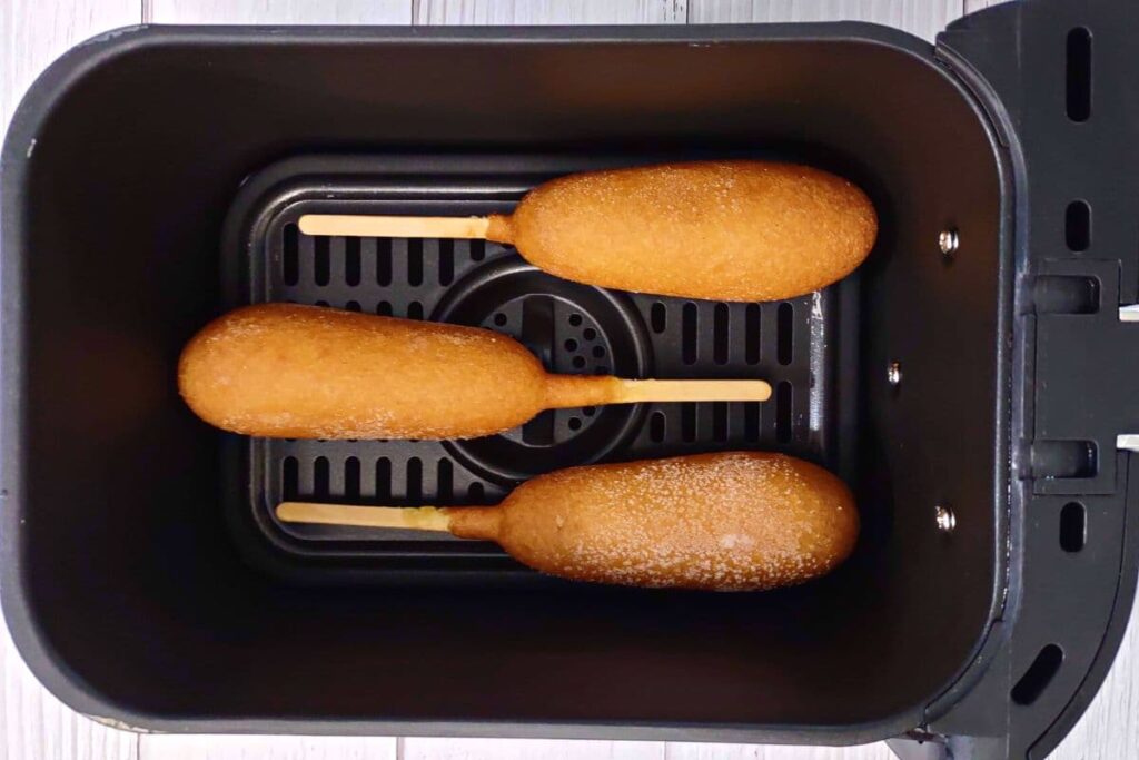 place corn dogs in air fryer basket