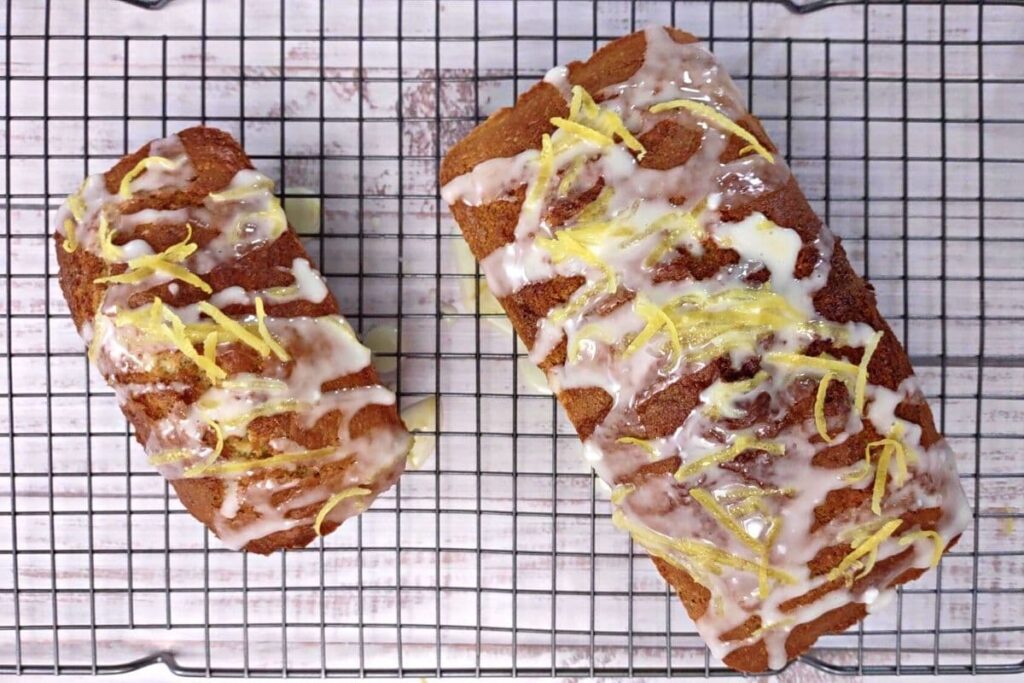 two fully glazed loafs of lemon poppy seed bread