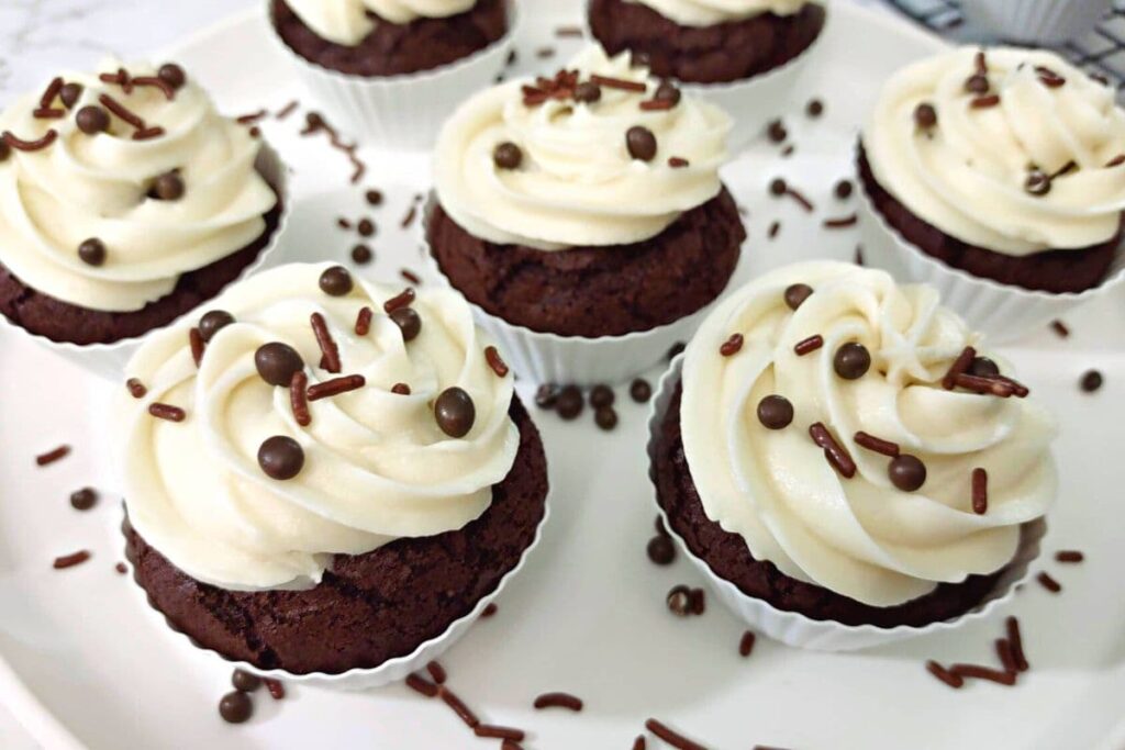 air fryer chocolate mocha cupcakes on a plate with chocolate sprinkles