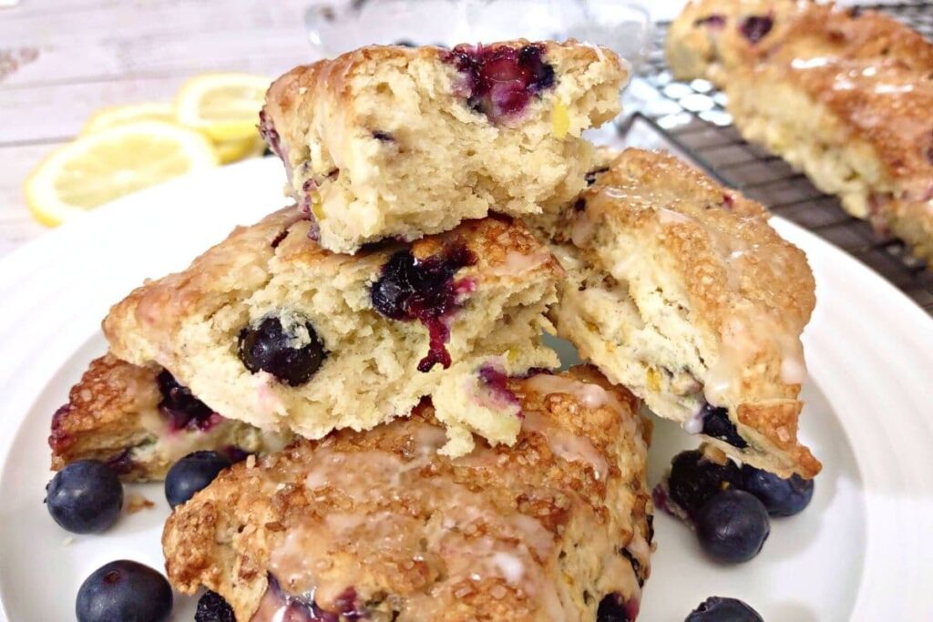 blueberry scones stacked up on a plate