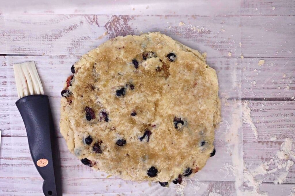 brush the top of the scone with milk and press in sugar