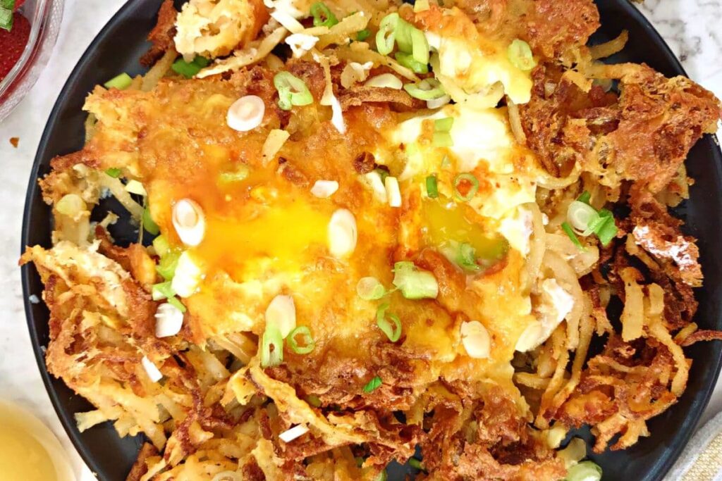 closeup of air fryer cheesy hash browns and eggs