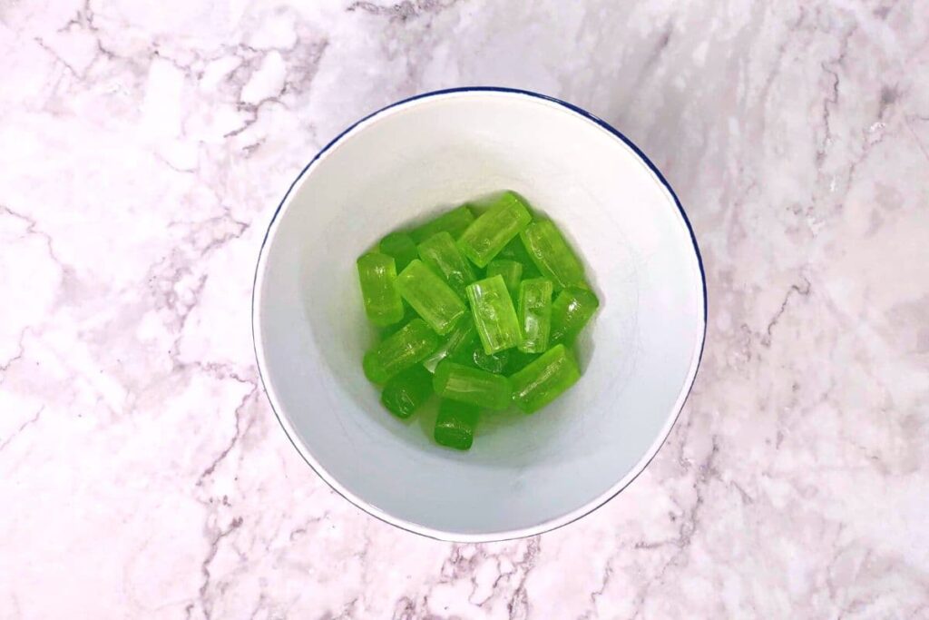 place additional jolly ranchers in a microwave safe bowl