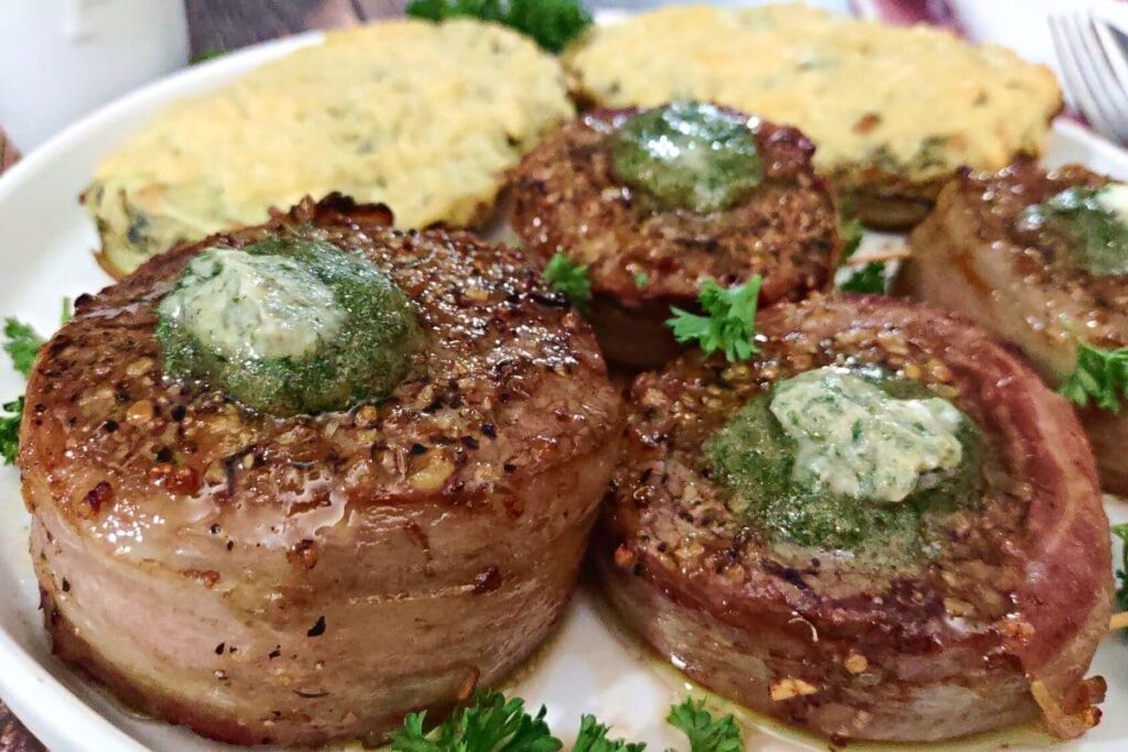 three air fryer bacon wrapped filet with garlic butter on top