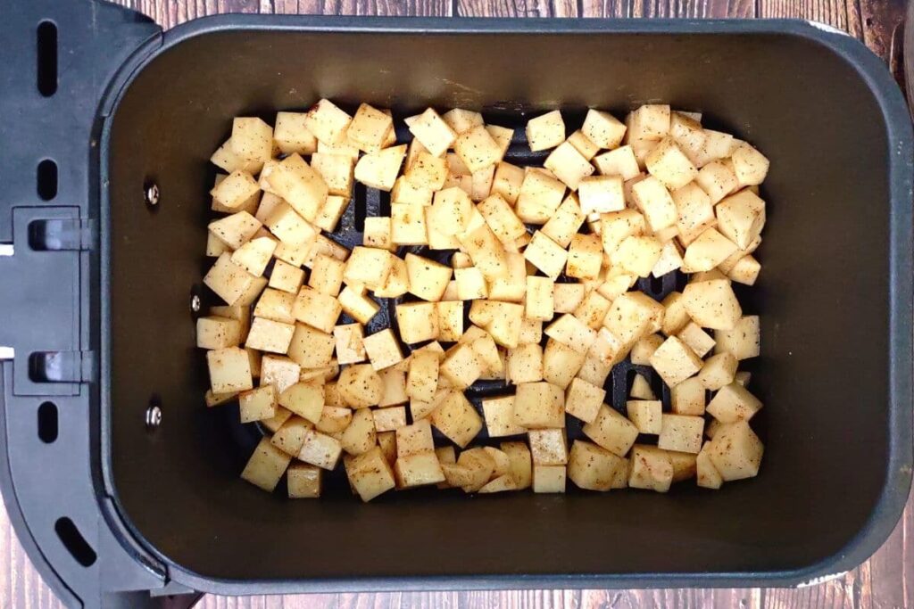 add seasoned potatoes to air fryer basket