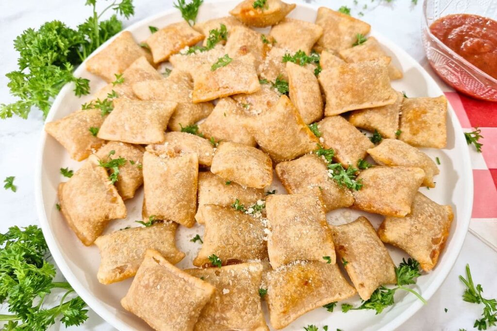 large plate filled with air fryer frozen pizza rolls