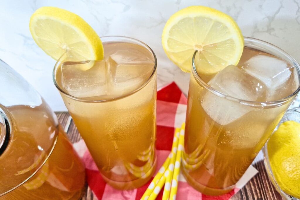 looking down at two glasses of sweet tea vodka lemonade with lemon slices