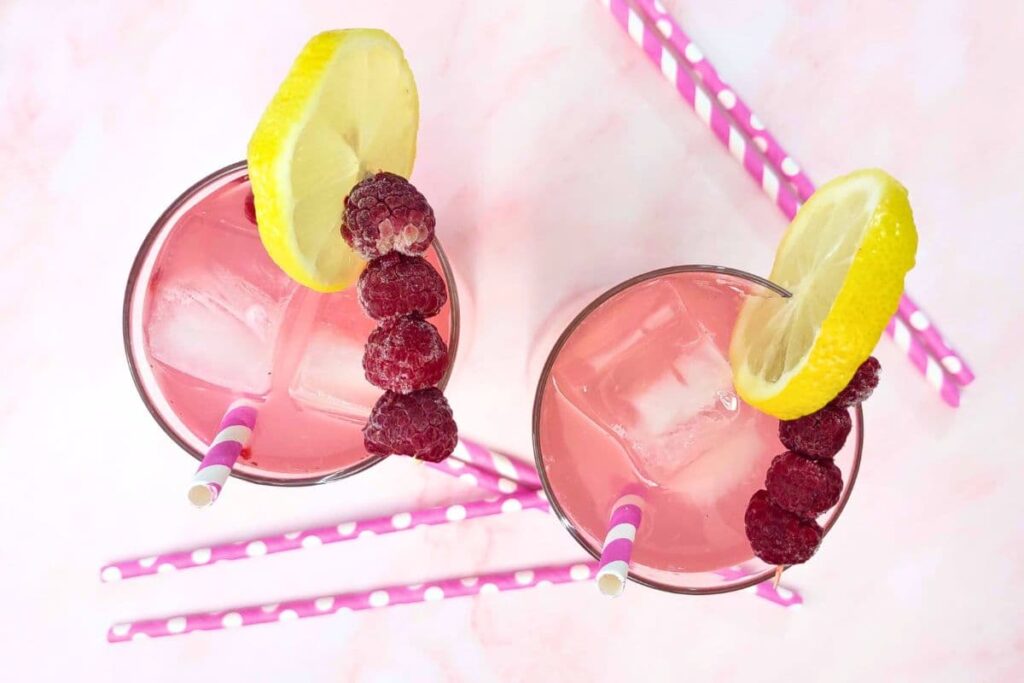 overhead view of two glasses filled with raspberry vodka lemonade