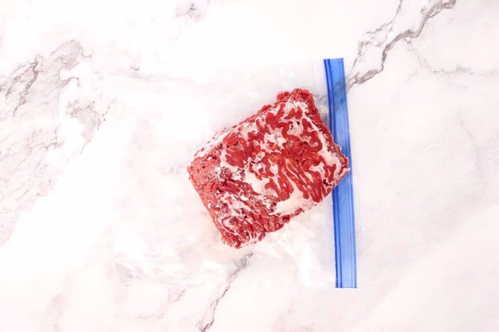 remove frozen ground beef from plastic wrapping or ziploc bag