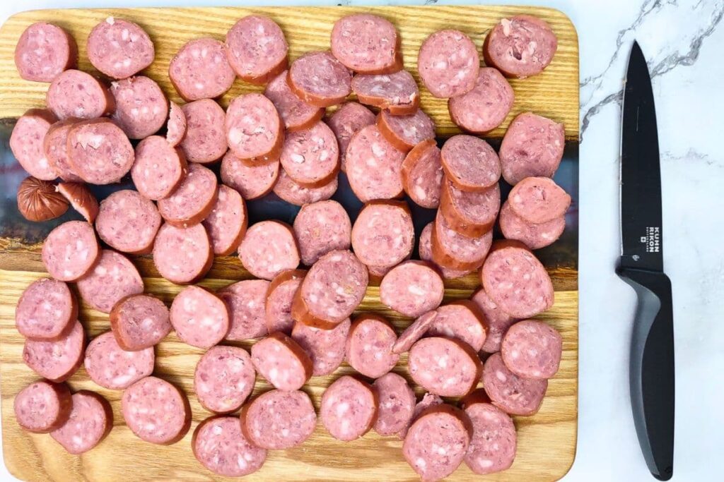 slice the tube of smoked sausage into bite size slices