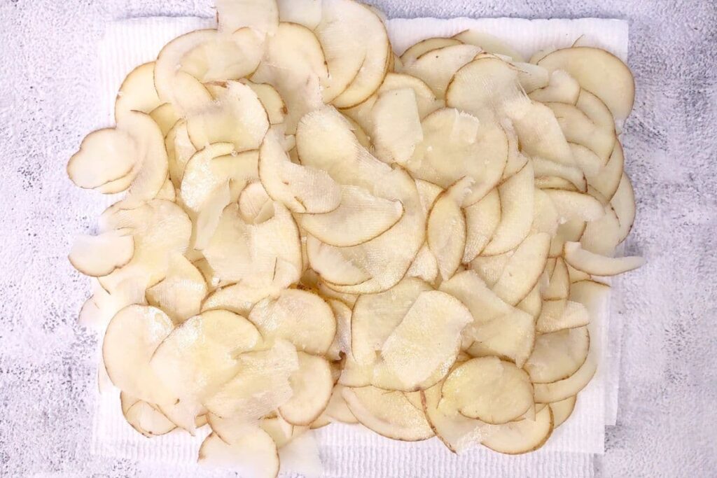 spray potato slices with oil and add salt