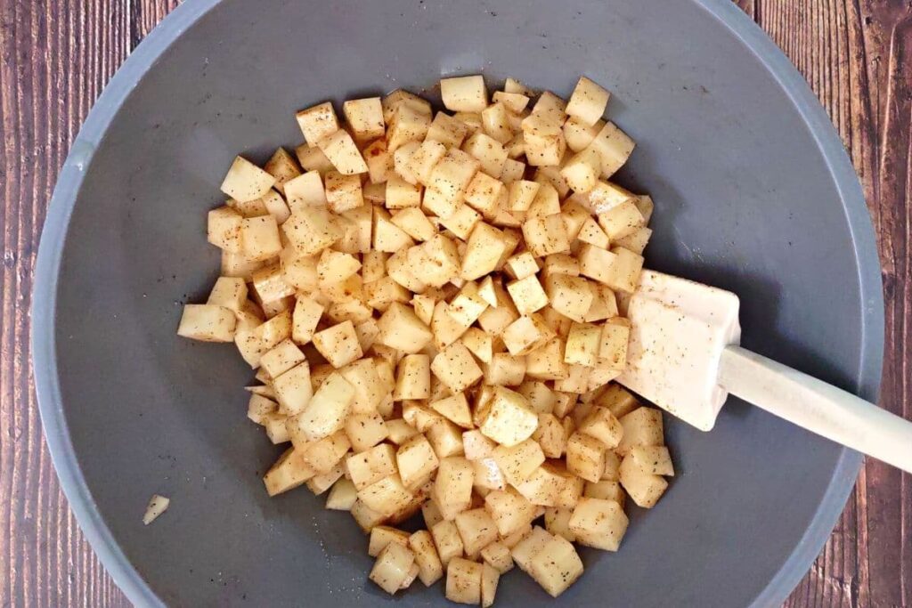 toss potatoes in olive oil, salt, pepper, and paprika