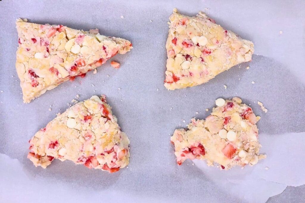 add strawberry white chocolate scones to parchment lined tray