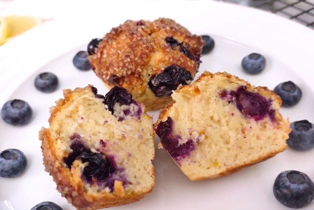 closeup of a fresh and warm blueberry muffin cut in half