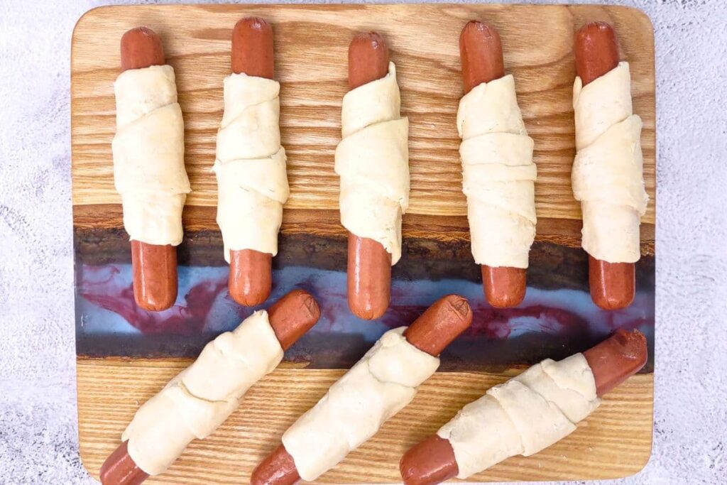 continue rolling all hot dogs in crescent dough