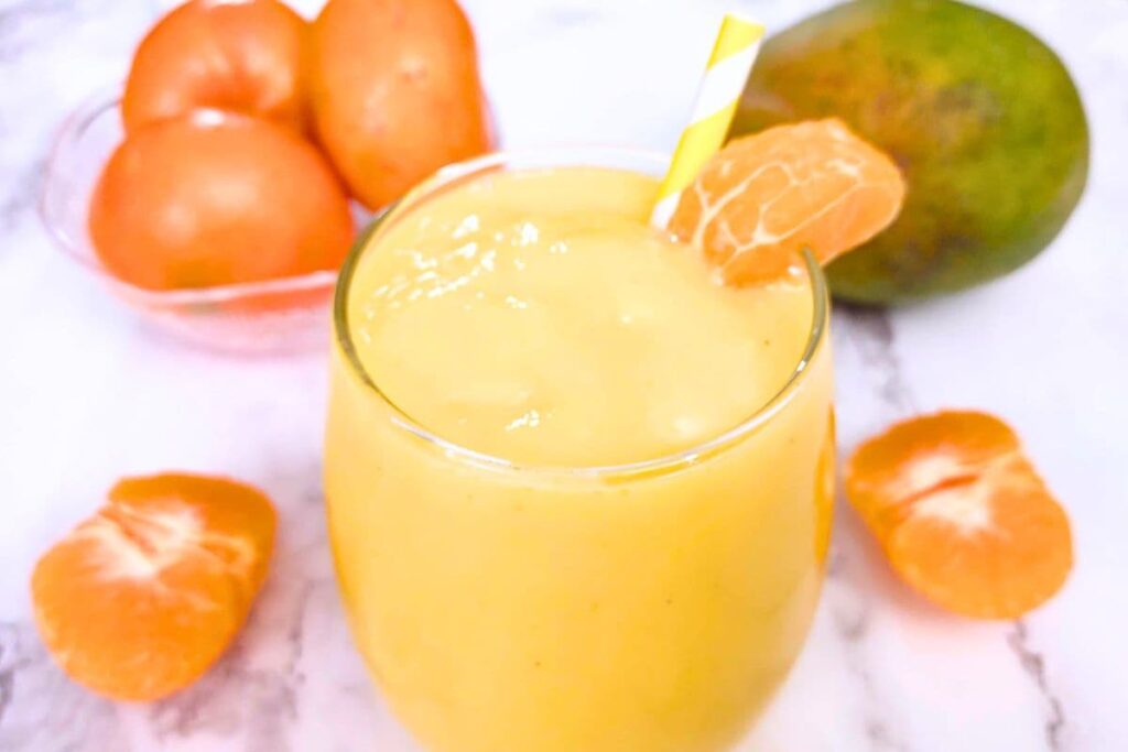 delicious glass of orange mango smoothie