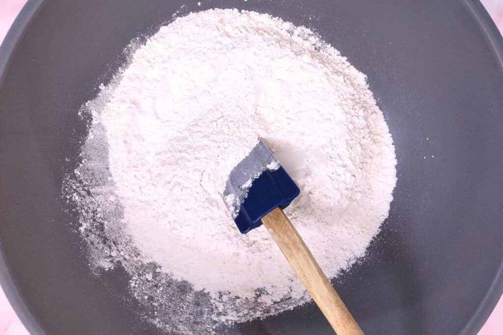 in a large mixing bowl combine flour, sugar, baking powder, and salt