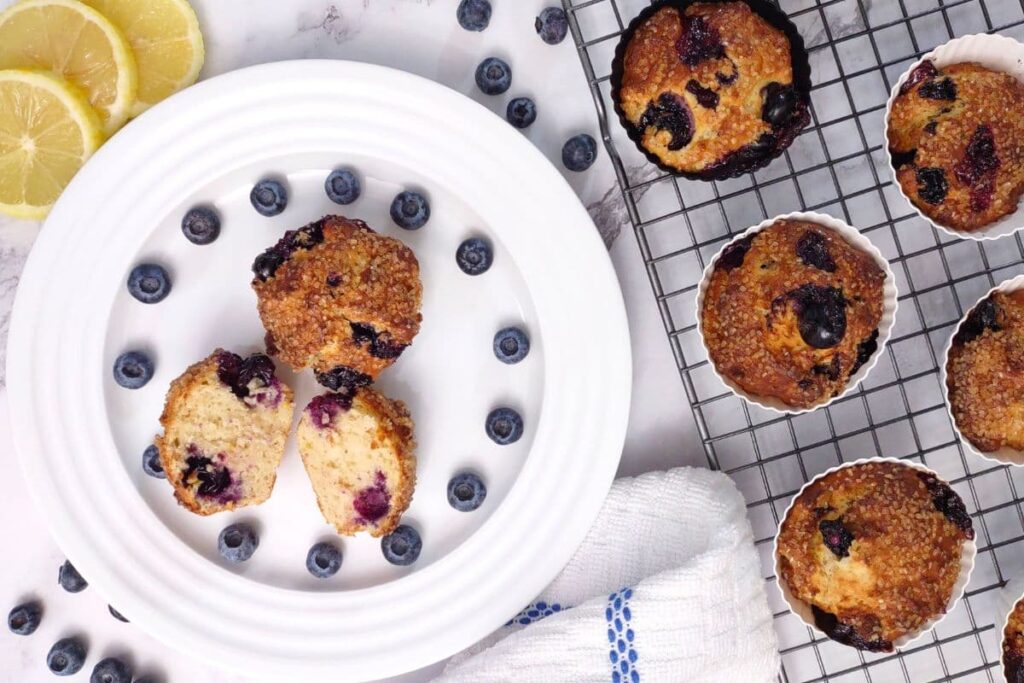 overhead view of air fryer blueberry muffins on a plate and wire rack
