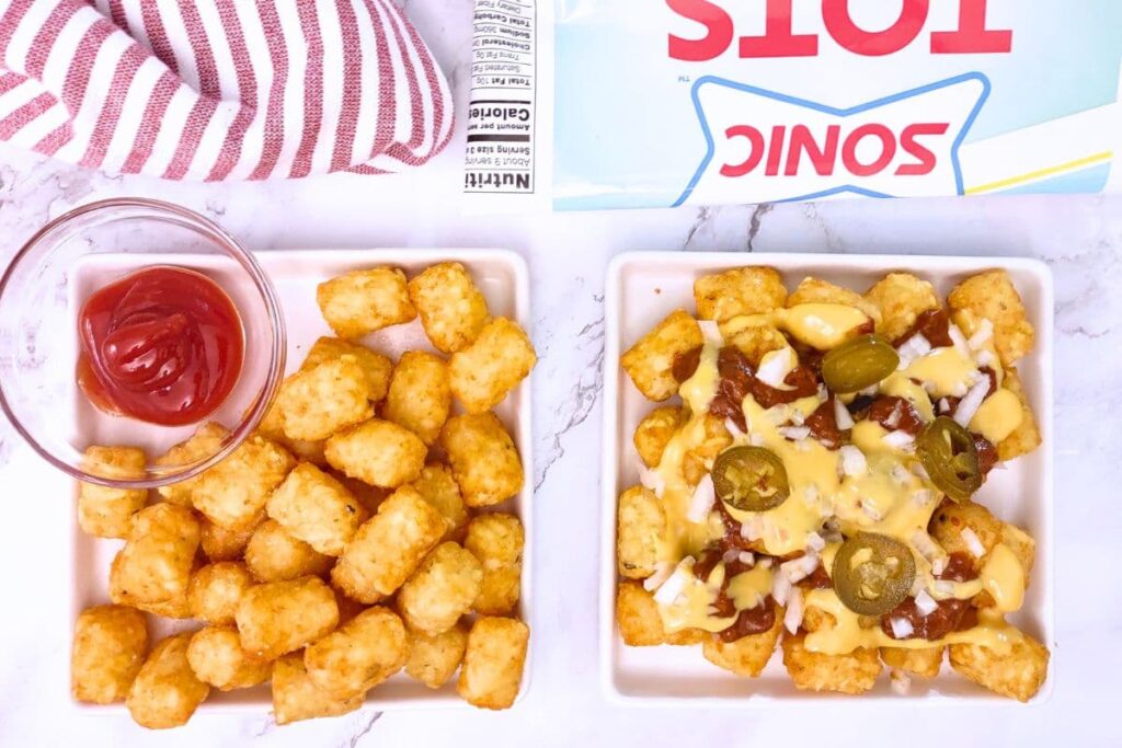 overhead view of air fryer sonic tater tots plain and chili cheese