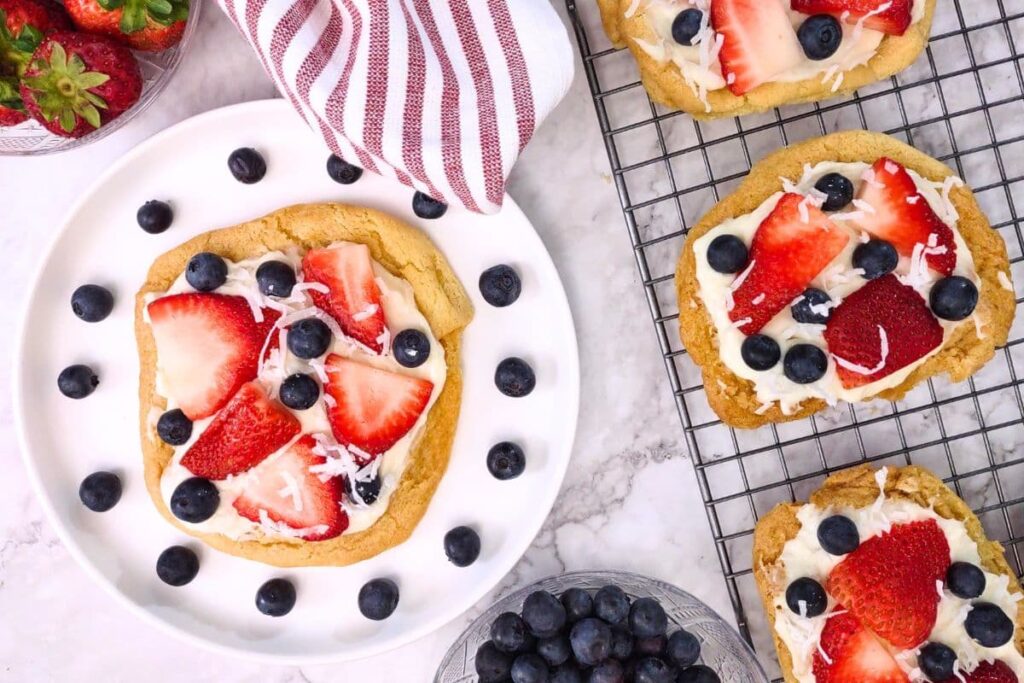 overhead view of air fryer sugar cookie fruit-pizza with fresh blueberry and strawberry