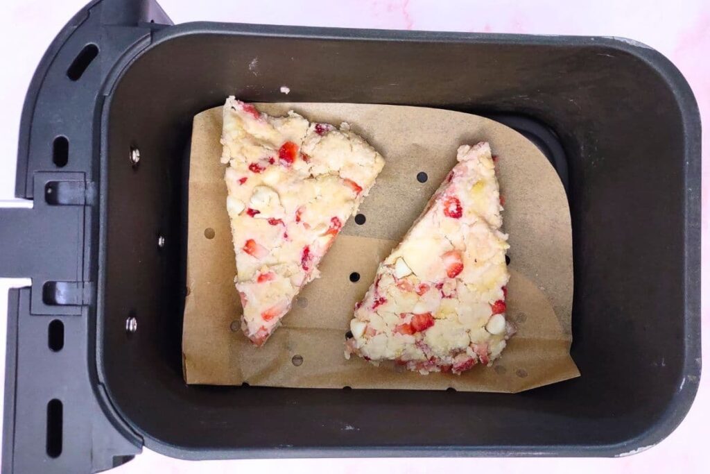 place strawberry white chocolate scones in air fryer basket
