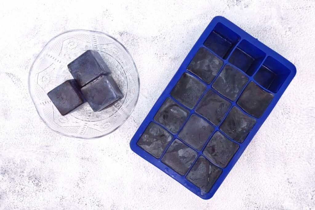 pour tea water into ice cube trays and freeze