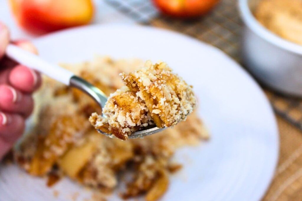 a spoonful of sweet air fryer apple crumble