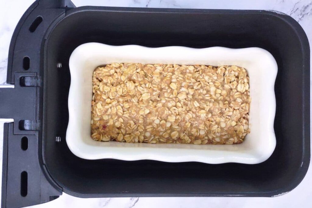 add the oatmeal filled baking dish to air fryer basket