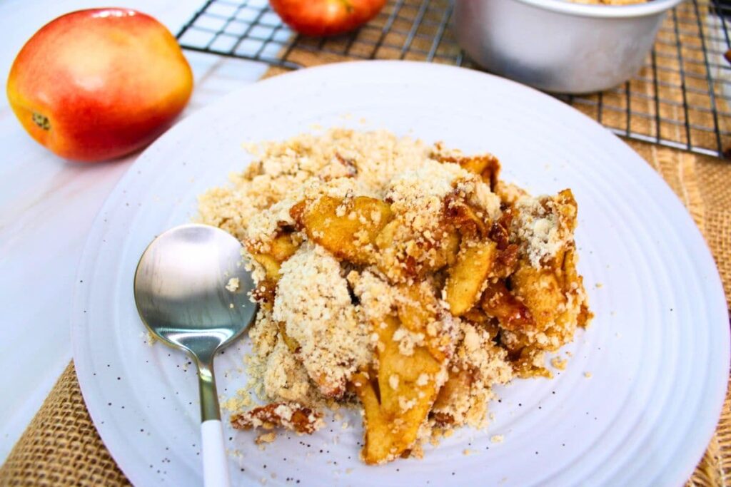 delicious air fryer apple crumble on a plate with a spoon