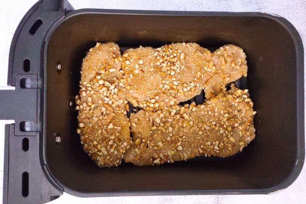 place pretzel crusted chicken cutlets in air fryer basket