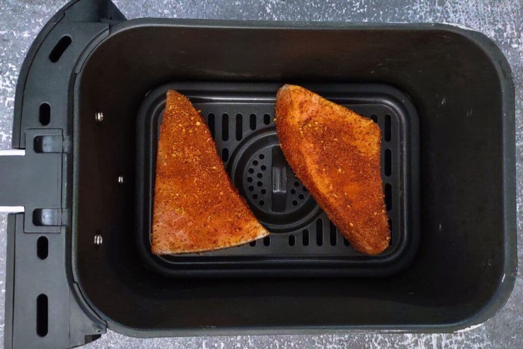 place seasoned swordfish steaks in air fryer basket
