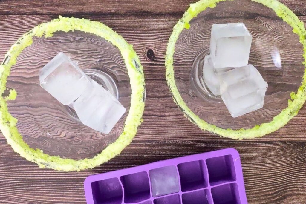 add ice cubes into your margarita glasses