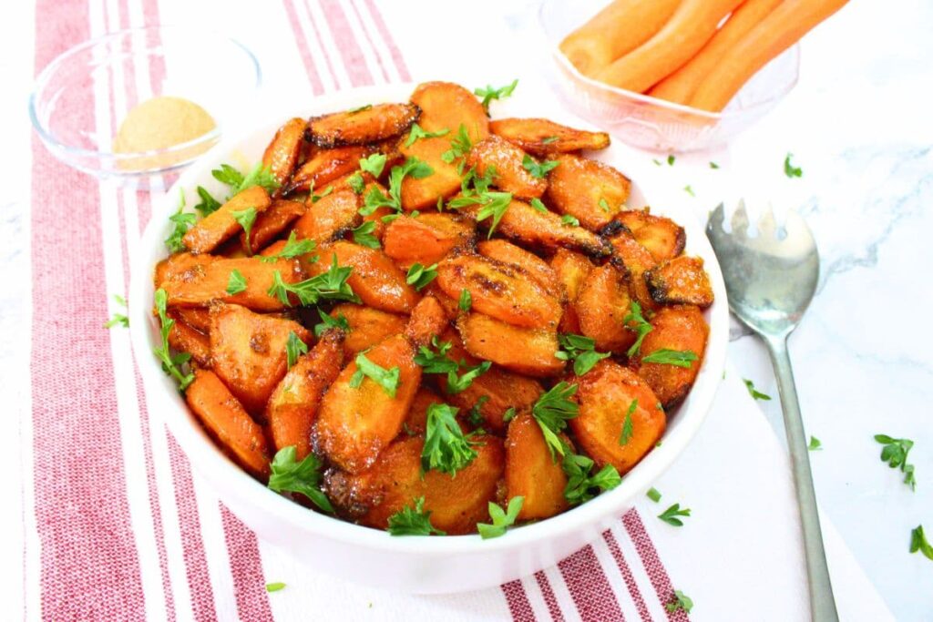 delicious bowl of sweet roasted air fryer carrots with brown sugar glaze
