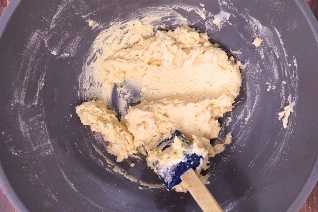 in a mixing bowl cream together butter and sugar