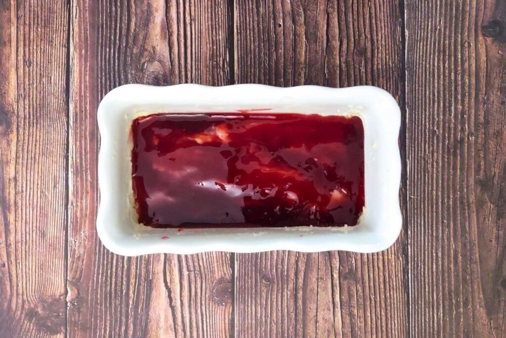 layer raspberry preserves over the coffee cake batter