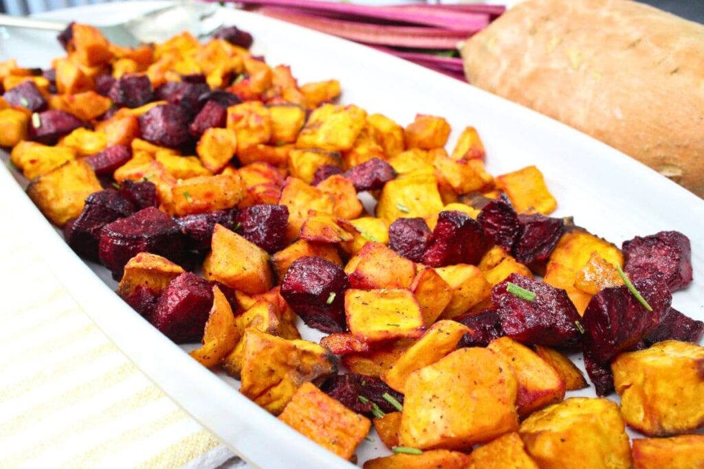 looking down a long serving tray or air fryer beets and sweet potatoes