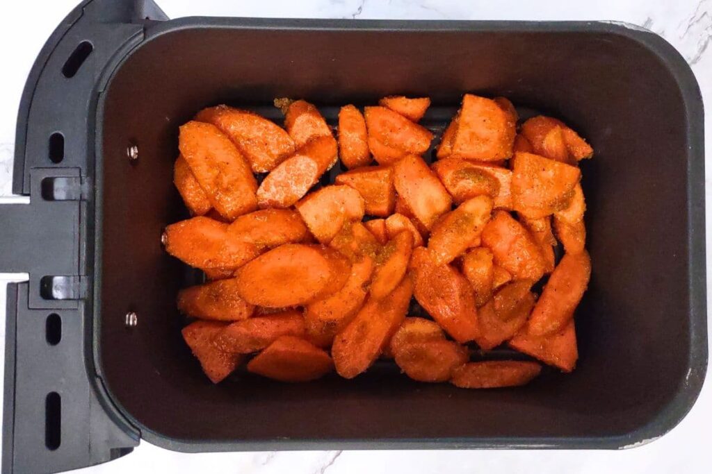 place coated carrots in air fryer basket