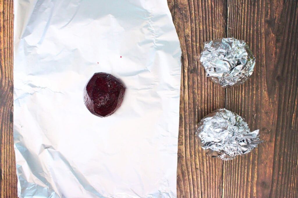place each beet on a square of aluminum foil and wrap them up