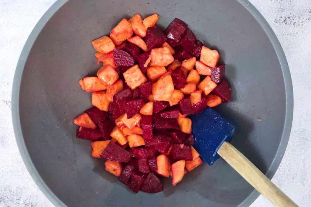 toss the beets and sweet potatoes with oil and seasoning