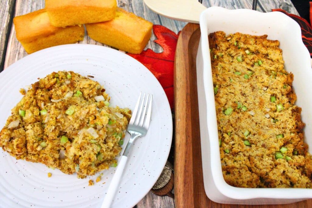 easy air fryer cornbread dressing on a plate next to the main casserole dish