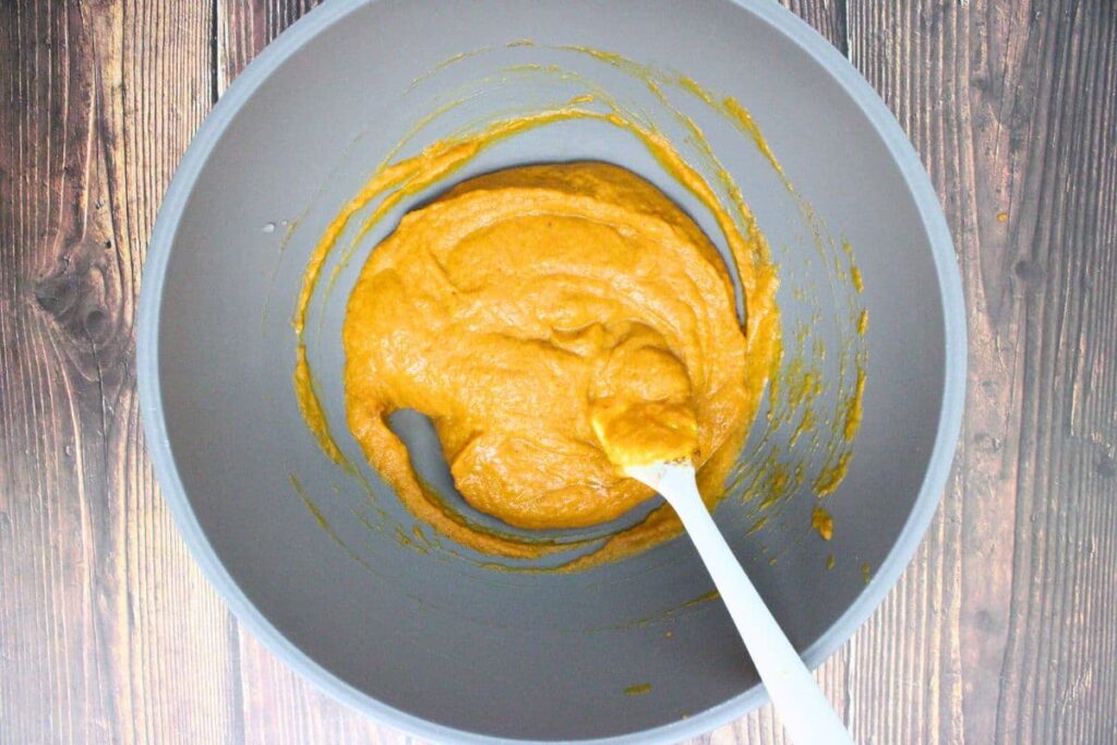 in a mixing bowl combine pumpkin puree, egg, brown sugar, heavy cream, pumpkin pie spice, and salt