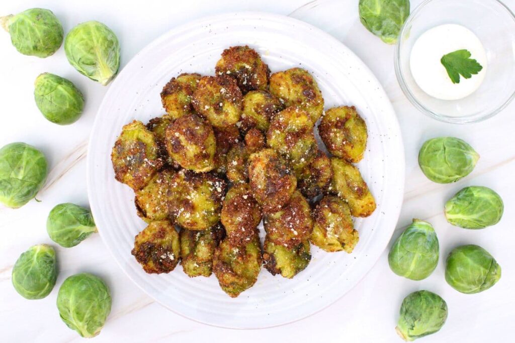 overhead view of air fryer smashed brussel sprouts on a plate