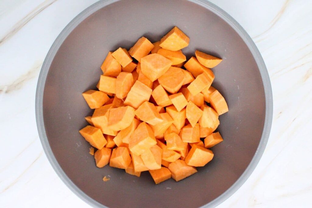 peel and cut sweet potatoes into cubes or drain canned yams