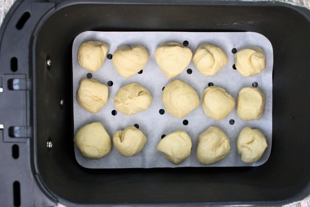 place biscuit dough bites in air fryer basket