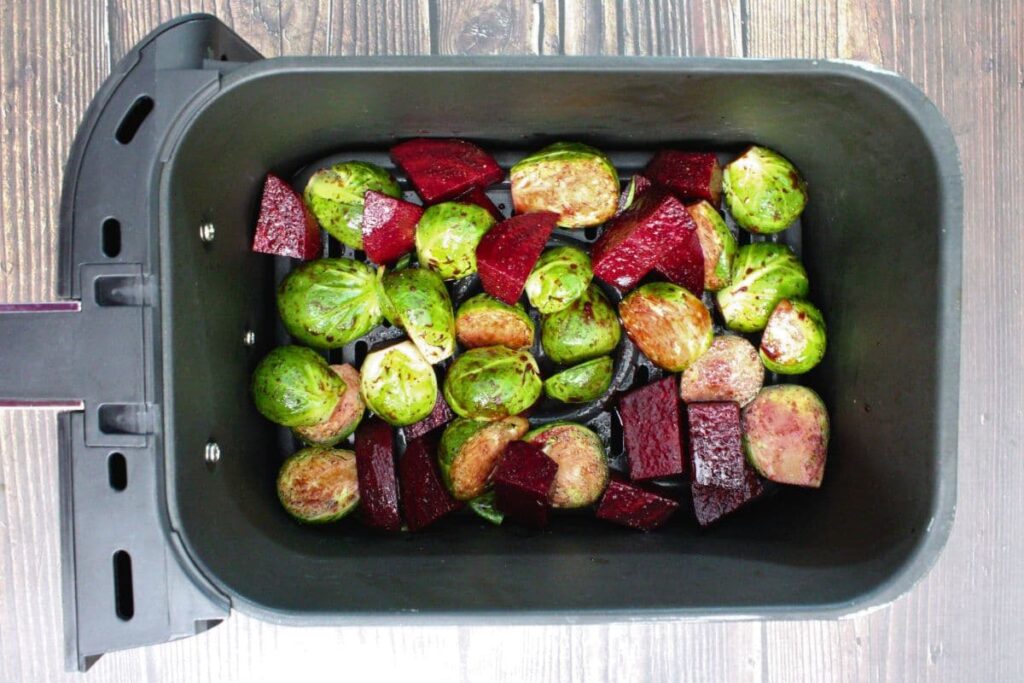 place brussels sprouts and beets in the air fryer basket