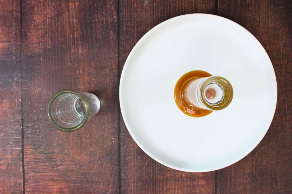 place caramel syrup on a plate and rim your shot glass