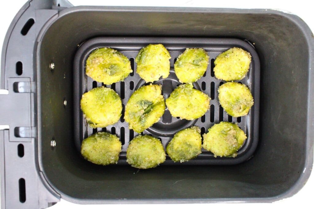 place seasoned brussel sprouts in air fryer basket